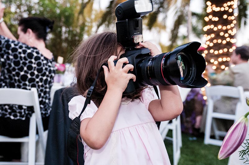 Little girl with a large camera